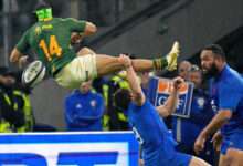 South Africa wing Cheslin Kolbe tackled in the air against France PA