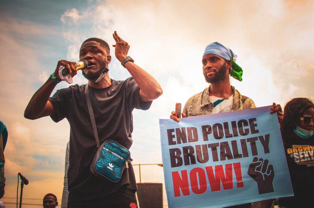 A new Dawn 
Photo by Tope A. Asokere: https://www.pexels.com/photo/a-man-holding-using-microphone-while-protesting-5789291/